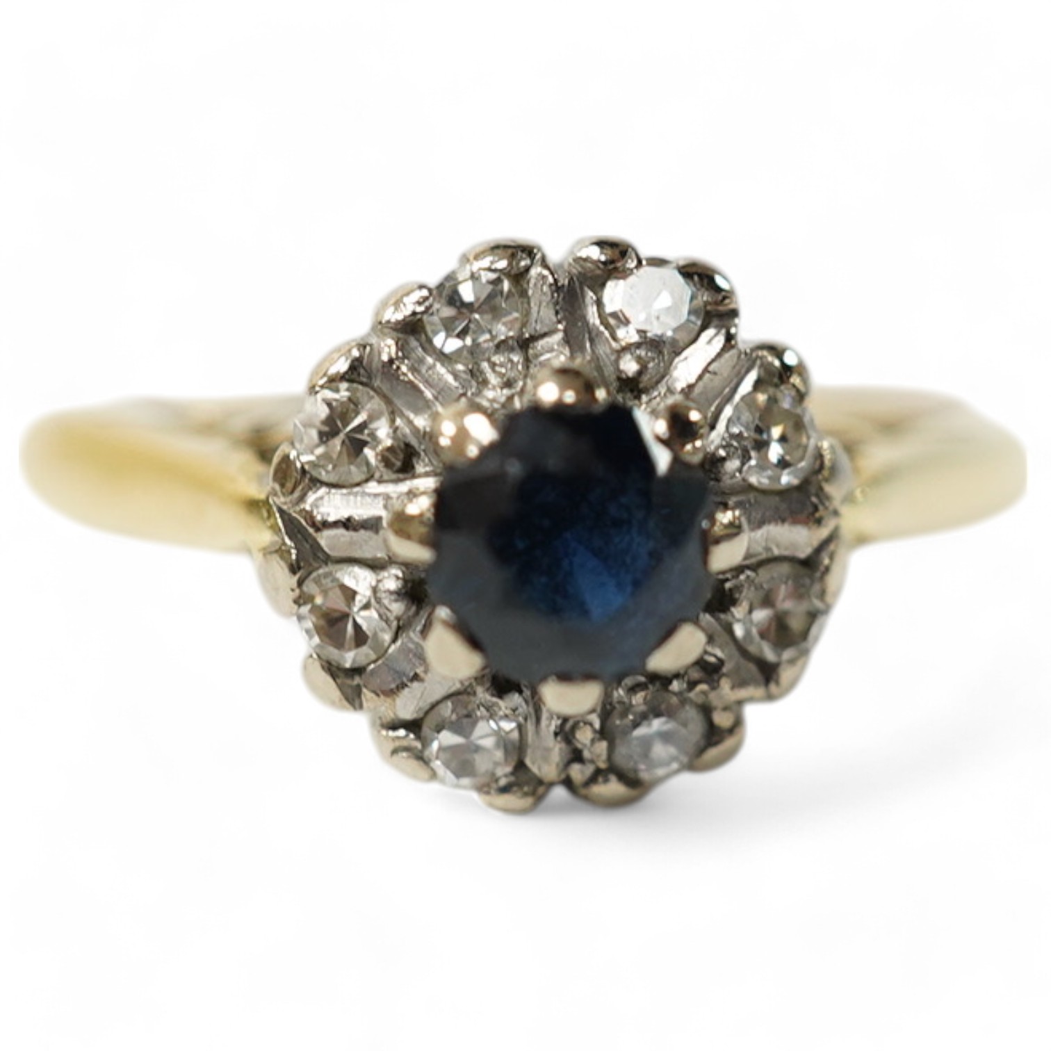 A small 18ct gold, sapphire and diamond set circular cluster ring, size J, gross weight 2.3 grams. Condition fair to good